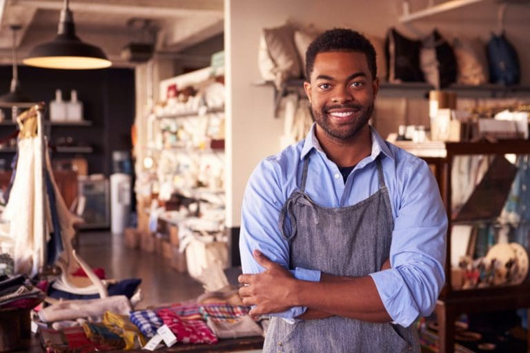 Black male frontline worker in a storefront